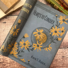 Load image into Gallery viewer, Hearts to Conquer by Kate T Sizer Beautiful Floral Cloth Binding