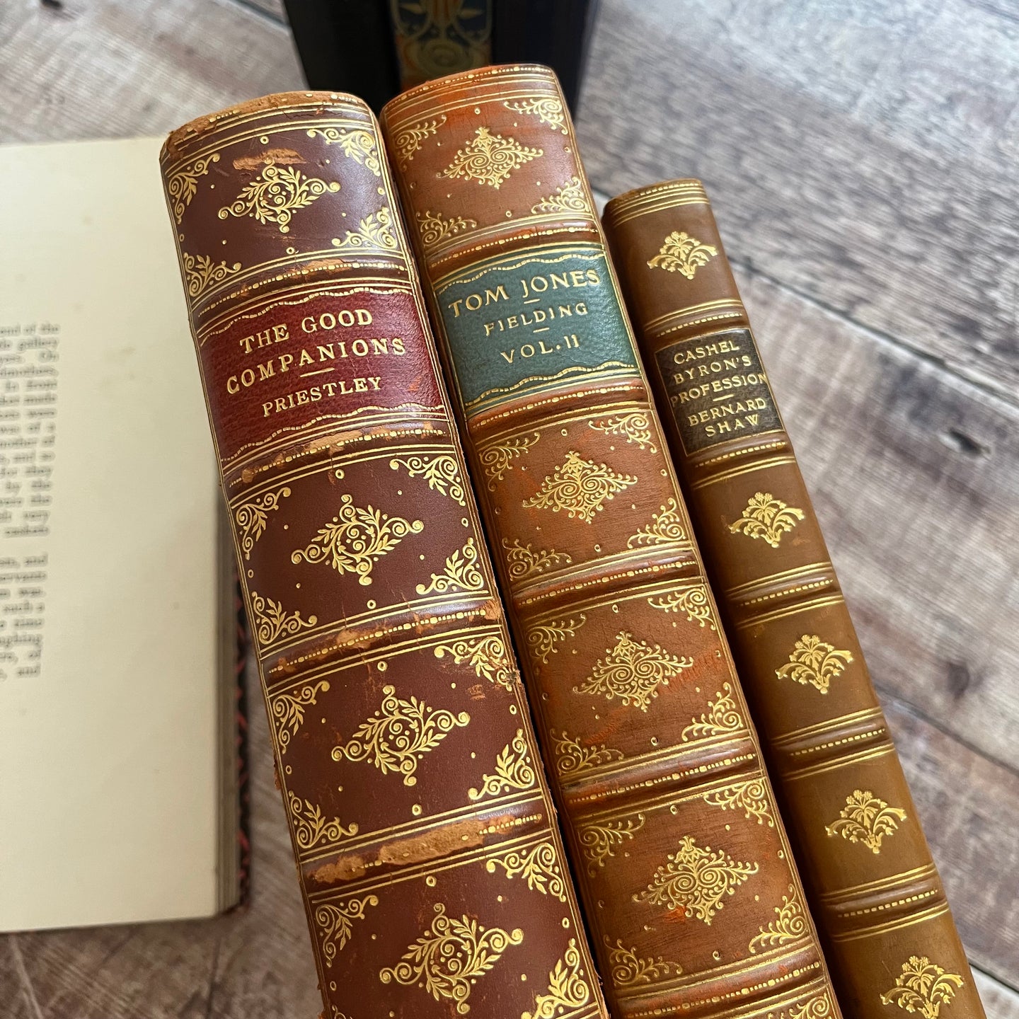 Stack of Three Early 20th Century Half Leather Vintage Books with Gilt Decorated Spines